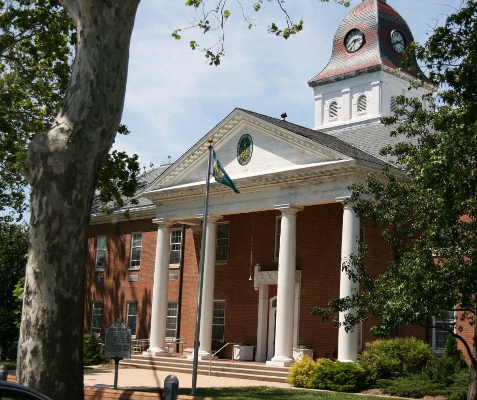 A historic brick building with a glowing theater marquee on a downtown street at twilight.A historic brick building with a glowing theater marquee on a downtown street at twilight.